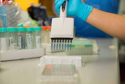 Cropped hands of scientist experimenting in laboratory