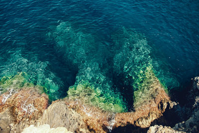 High angle view of rocks in sea