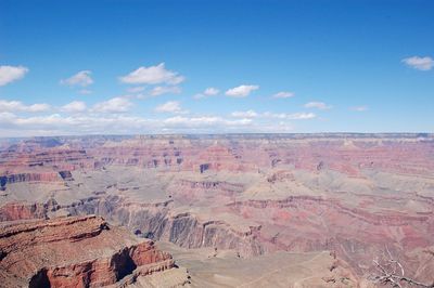 Scenic view of grand canyon national park against sky during sunny day