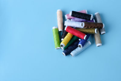 Close-up of colored pencils against blue background