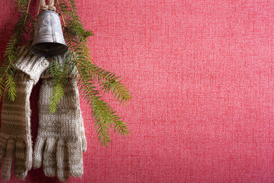 Christmas decoration hanging on pink wall