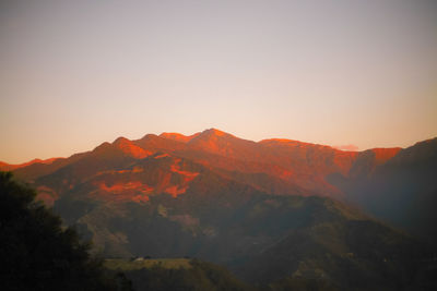 Scenic view of mountains against sky during sunset