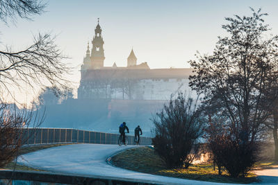 People walking in front of building