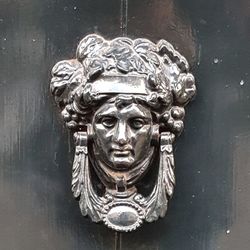 Close-up of statue against door