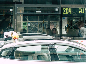 Reflection of people on glass window