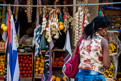 Woman standing at market stall