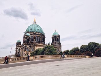 VIEW OF CHURCH AGAINST CLOUDY SKY