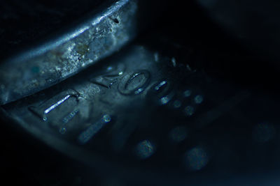 Close-up of raindrops on metal