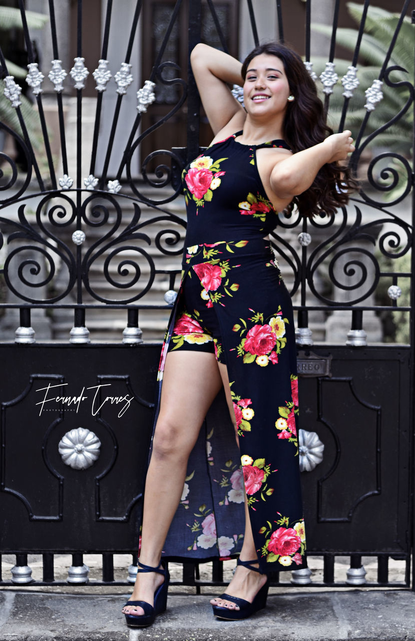 one person, young adult, young women, beautiful woman, full length, pattern, fashion, portrait, standing, beauty, clothing, real people, dress, adult, lifestyles, leisure activity, front view, women, looking at camera, hairstyle, hair, floral pattern