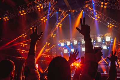 Cropped hands of man in music concert