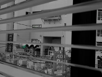 Low angle view of building seen through glass window