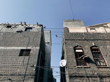 Low angle view of old building against sky