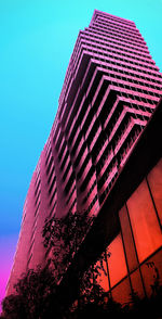 Low angle view of skyscraper against clear sky