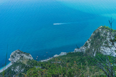 High angle view of rocks by sea