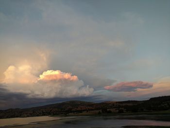 Scenic view of landscape against cloudy sky