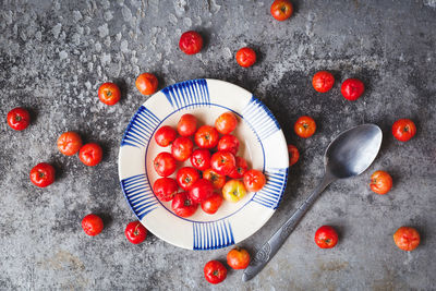 Directly above of cherry tomatoes on table