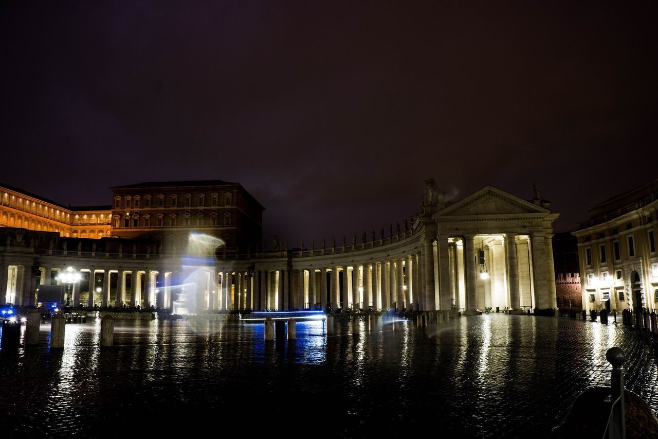 VIEW OF ILLUMINATED BUILDINGS AT NIGHT