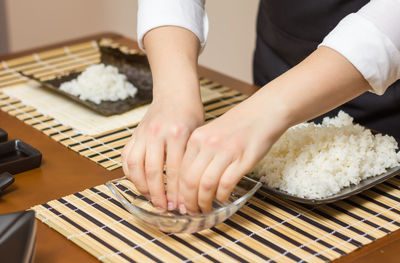 Midsection of woman preparing food