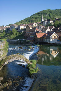 The village of lods and the loue river in the morning
