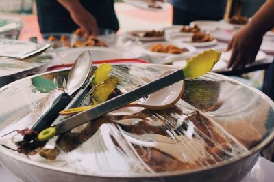 Close-up of food in container covered with plastic