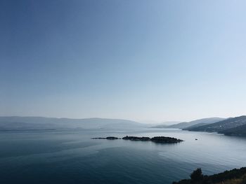 Scenic view of sea against clear blue sky