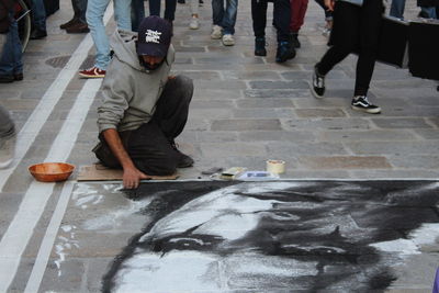 Low section of man walking on floor