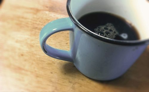 Close-up of coffee cup on table