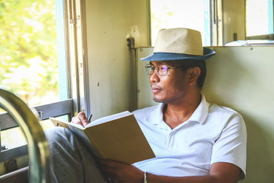 Portrait of young man looking away