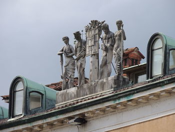 Low angle view of statue against sky