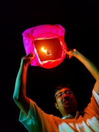 Low angle view of man at night