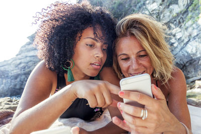 Portrait of young woman using smart phone