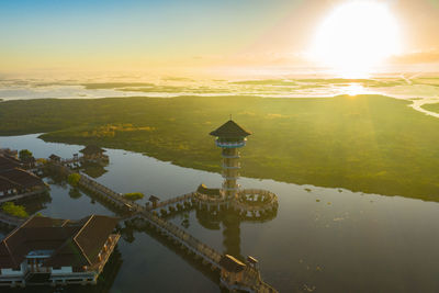 High angle view of buildings against sky during sunset