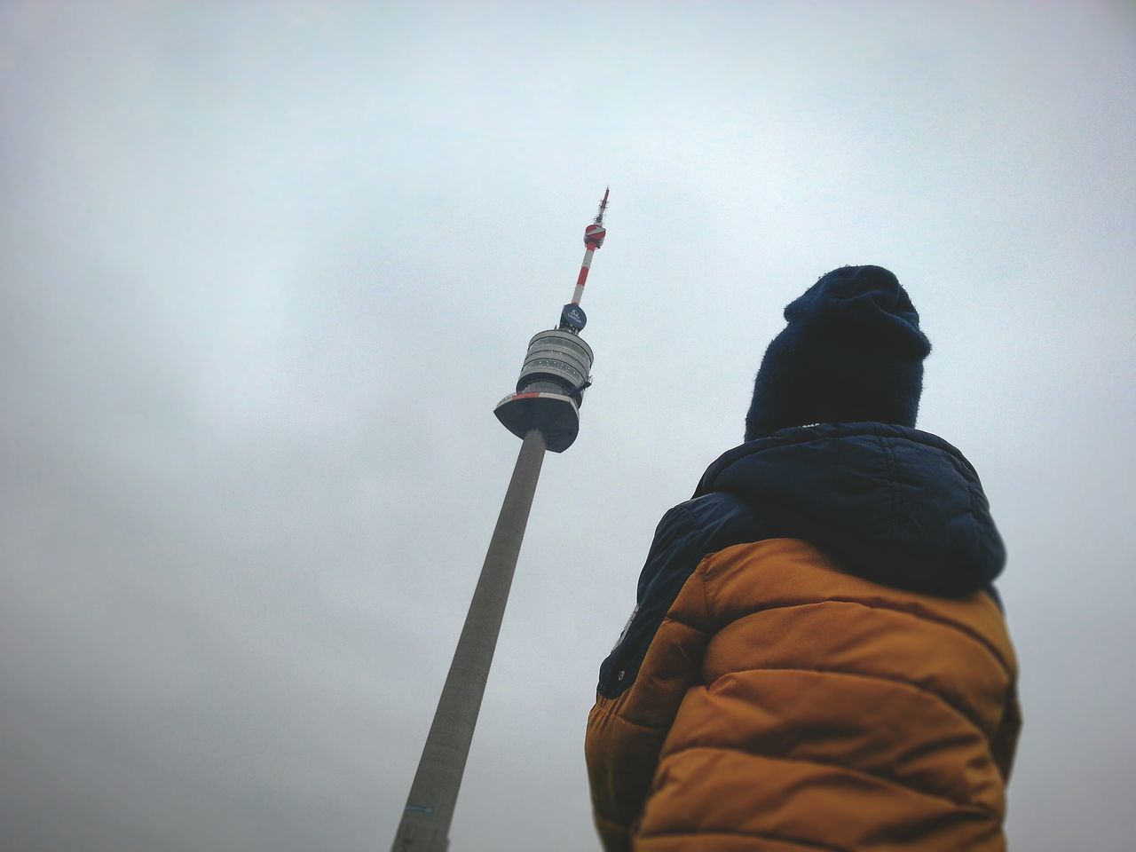 tower, sky, communication, winter, cloud - sky, outdoors, low angle view, one person, travel destinations, city, cold temperature, people, day, adult, adults only