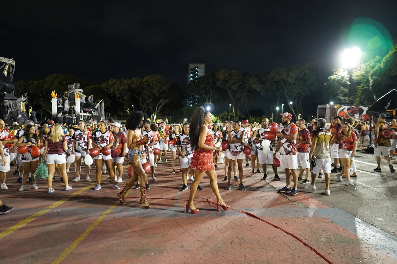 crowd, large group of people, group of people, night, festival, performance, musician, event, dancing, men, clothing, arts culture and entertainment, sports, street