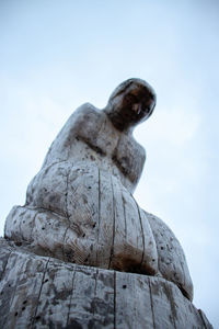 Low angle view of statue against sky