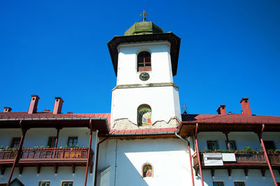 Low angle view of building against blue sky