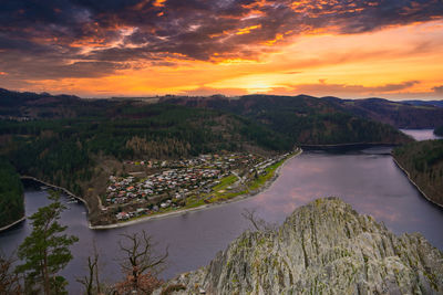 High angle view of bridge over river against sky during sunset