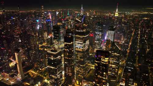 High angle view of illuminated cityscape at night