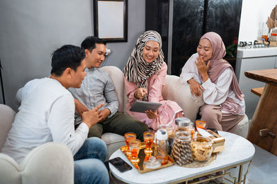 Portrait of friends sitting at home