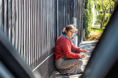 Young man using mobile phone while sitting in car