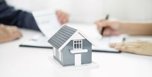 Cropped hand of man holding box