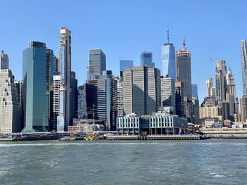 Modern buildings in city against clear sky