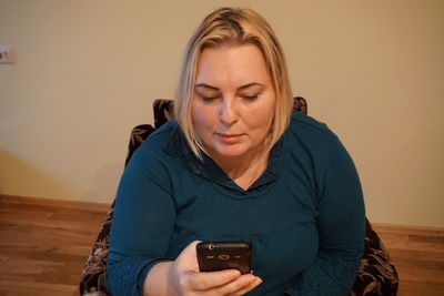 Portrait of teenage girl using mobile phone