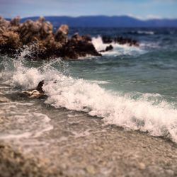 Waves splashing on rocks