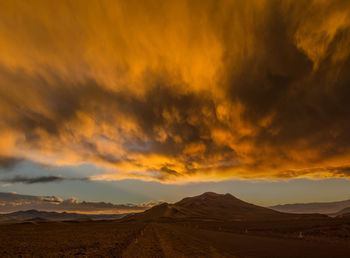 Scenic view of dramatic sky during sunset