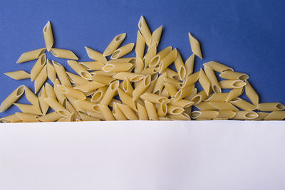 Close-up of fresh orange on table against blue background