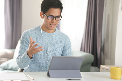 Young man using laptop on table