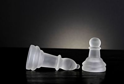 Close-up of chess pieces on table