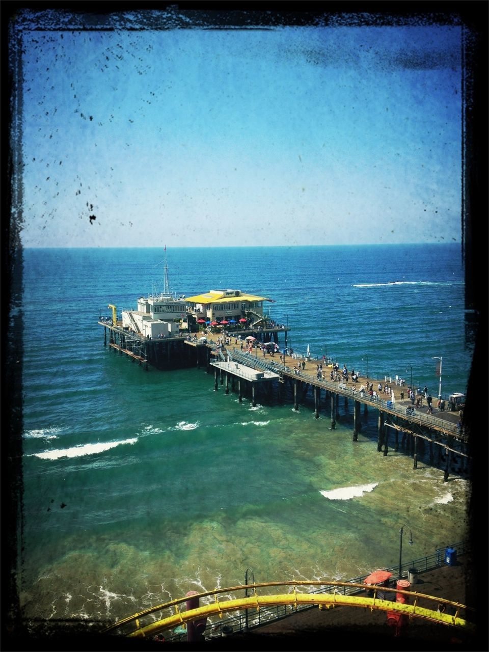 transfer print, sea, water, auto post production filter, horizon over water, transportation, built structure, architecture, nautical vessel, blue, sky, mode of transport, clear sky, incidental people, boat, beach, nature, high angle view, travel, pier