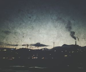 View of trees against sky at night